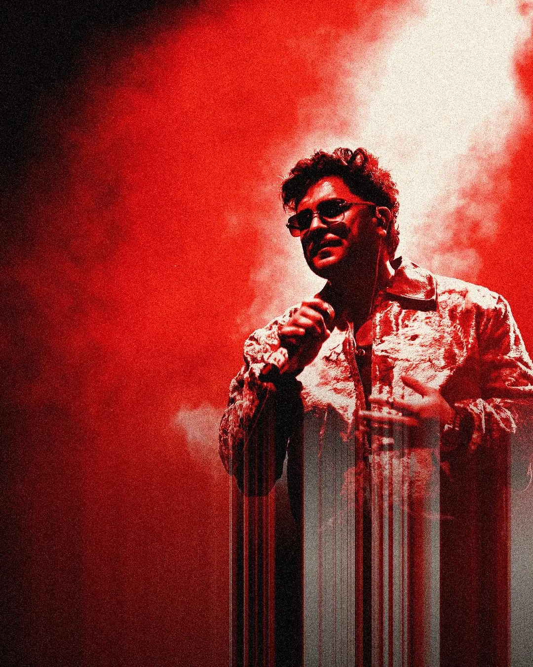 Asim Azhar on stage, red duotone
